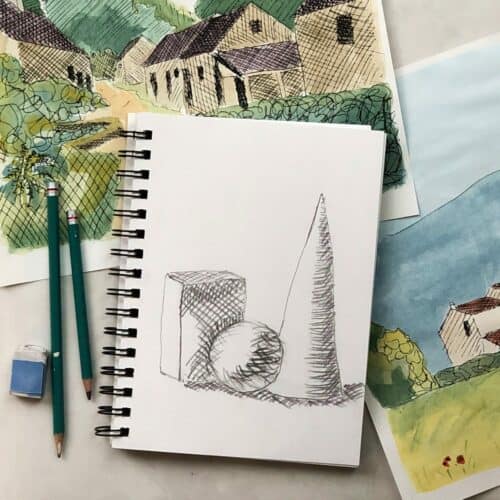 Crosshatching drawing of a cone, sphere, and box on a spiral notebook with colorful crosshatched watercolor paintings behind with drawing pencils and an eraser.