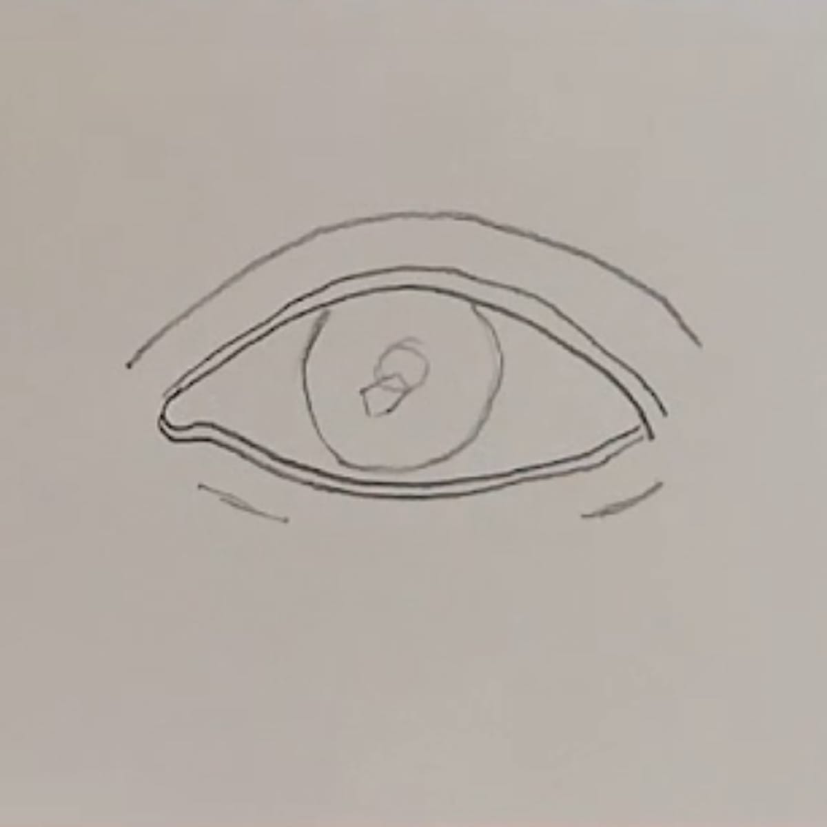 Draw in the iris, the pupil and a small highlight.