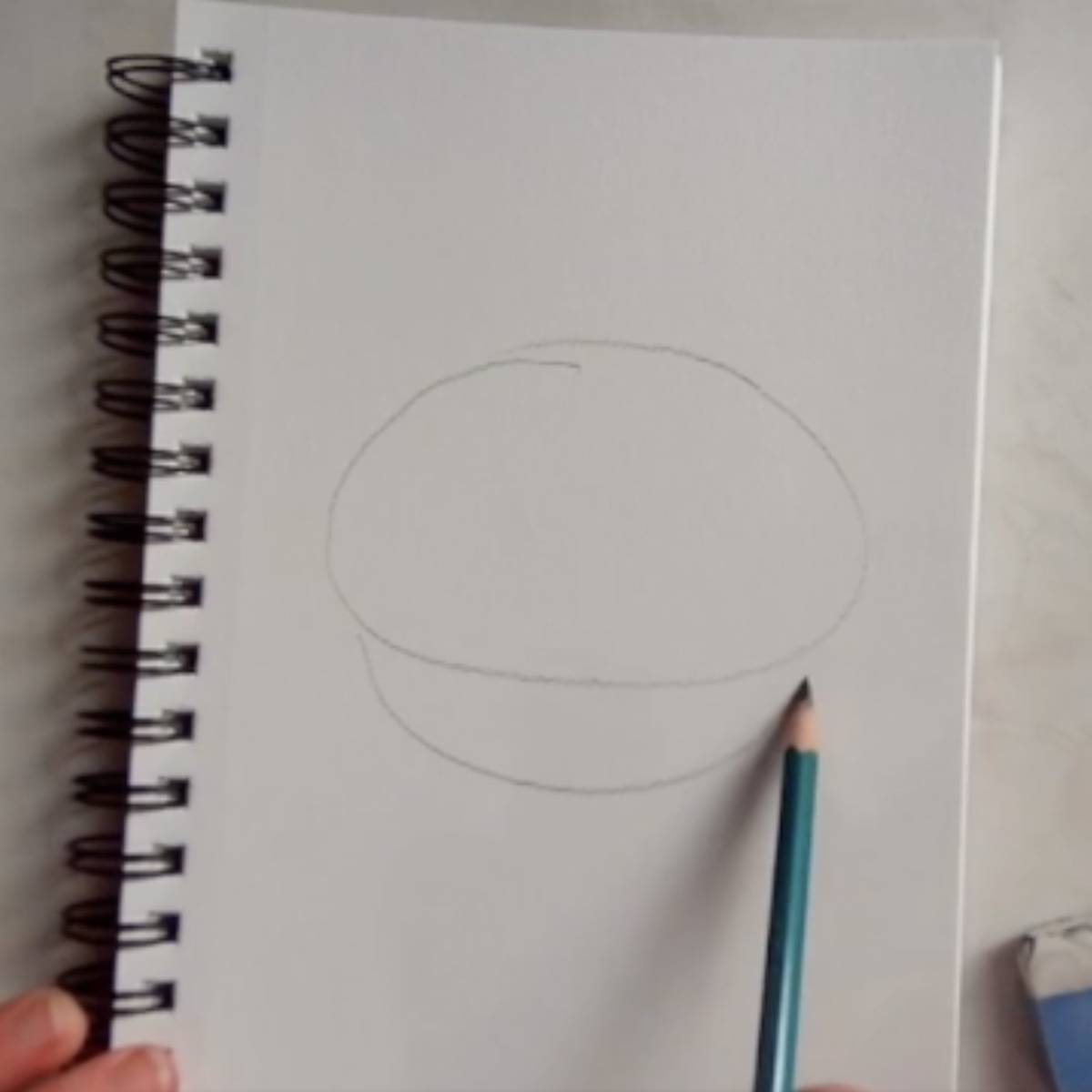 Sketch an oval with a bowl shape underneath 