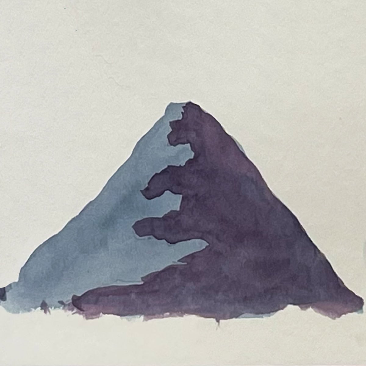 Two-toned triangle painting of a watercolor mountain.