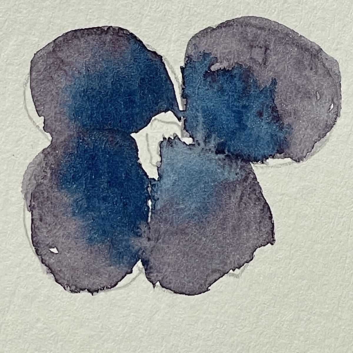 A watercolor painting of a pansy that shows a charging technique.